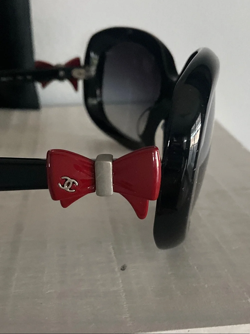 CHANEL Black Sunglasses with Red Accents and Gradient Lenses